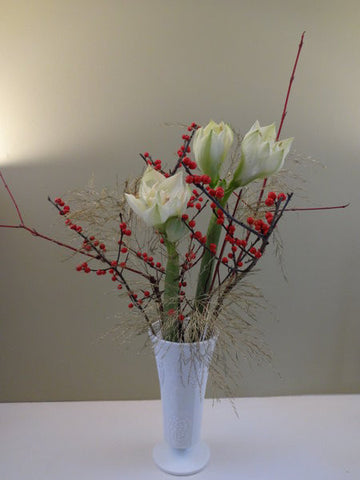 Berry in snow with vase